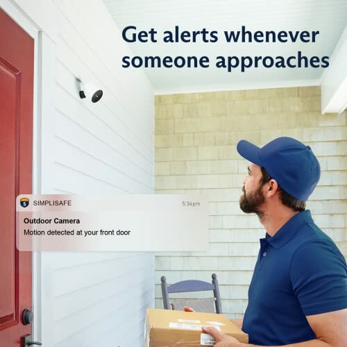 Delivery person with package looking at security camera alert on a porch.