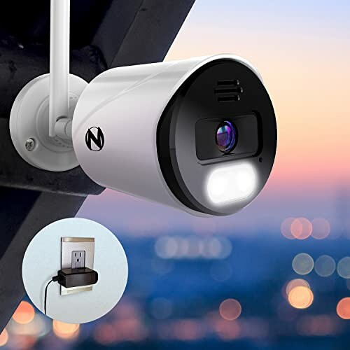 Outdoor security camera mounted on wall with night view