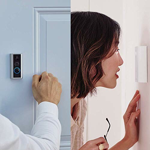 Man using smart doorbell with video feature, woman interacting indoors.