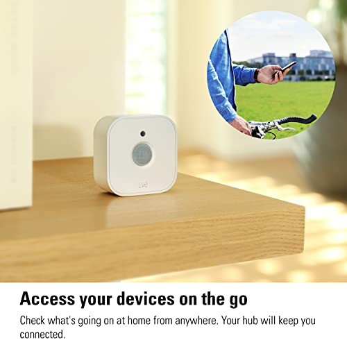 Smart home device on a shelf with a person using a smartphone on a bike.