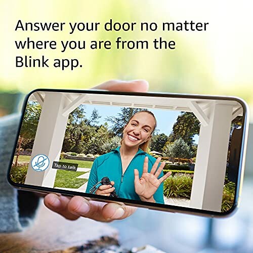 Person using smartphone app to answer video doorbell.